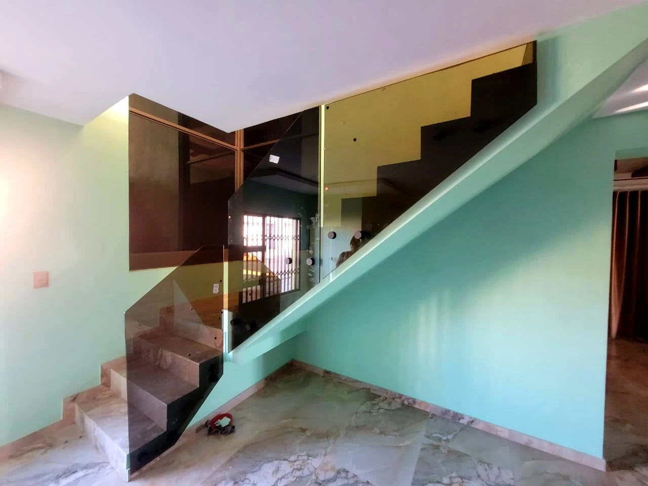 Floating staircase with glass balustrade in a modern interior
