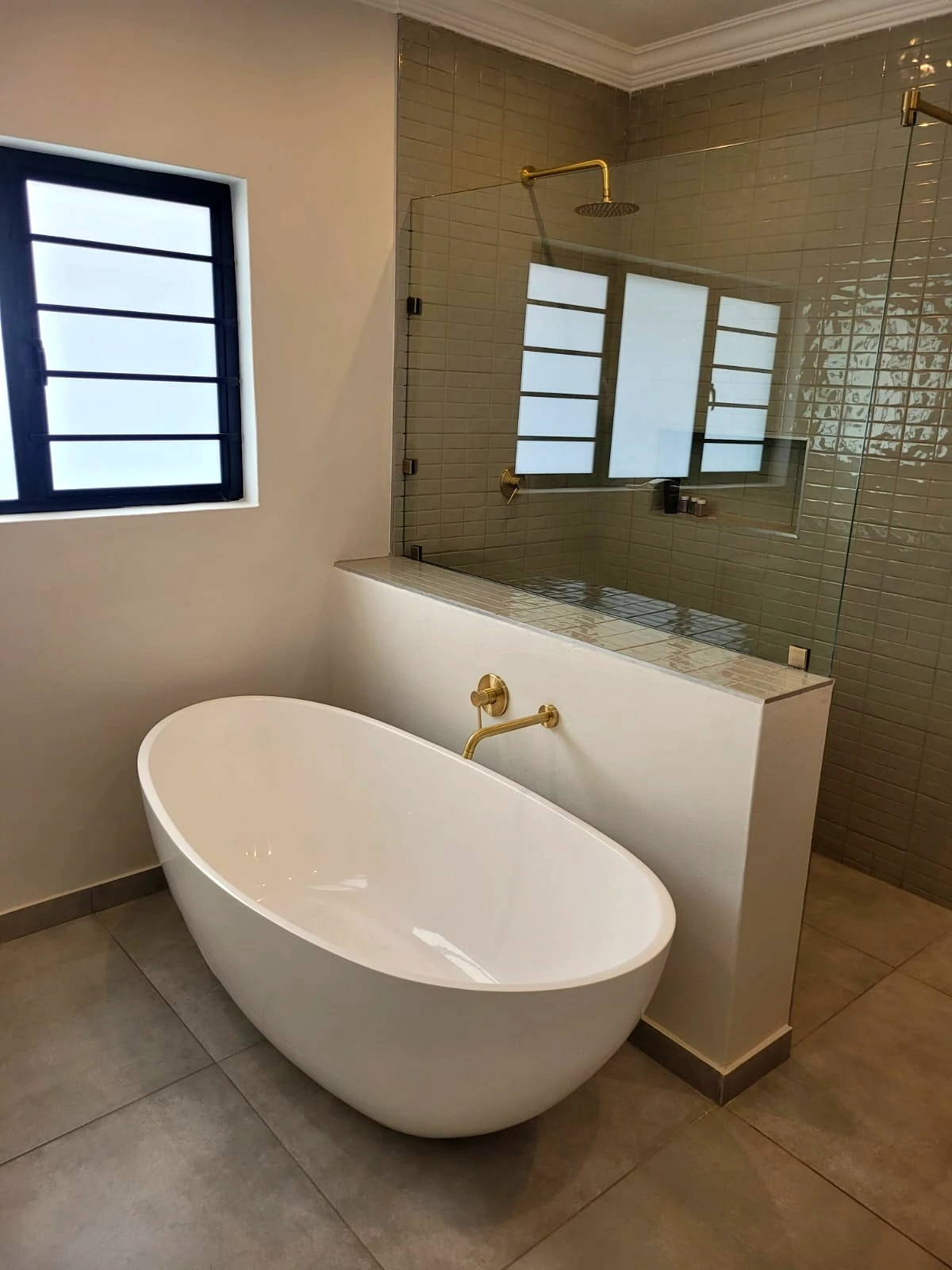 Freestanding bathtub in a modern bathroom renovation