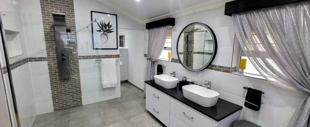 Modern bathroom double vanity design and fitted cabinetry