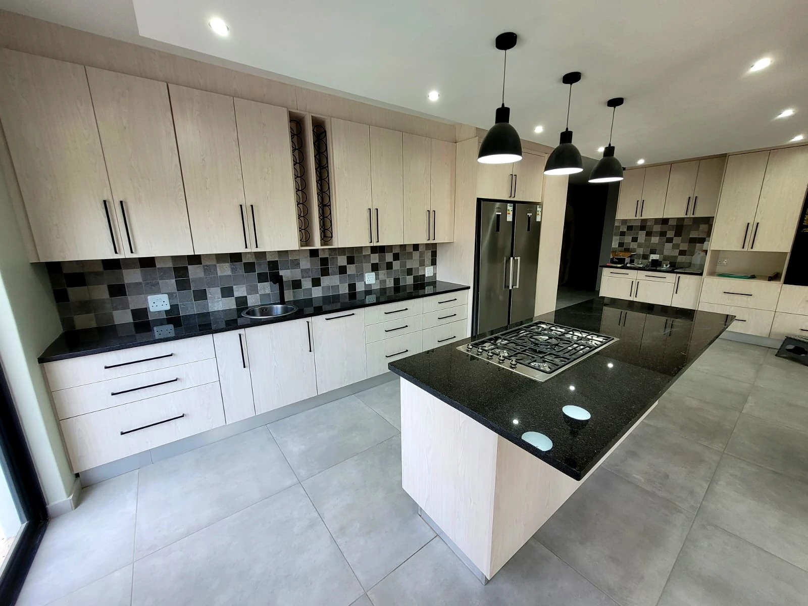 Modern white kitchen island design with custom cabinetry