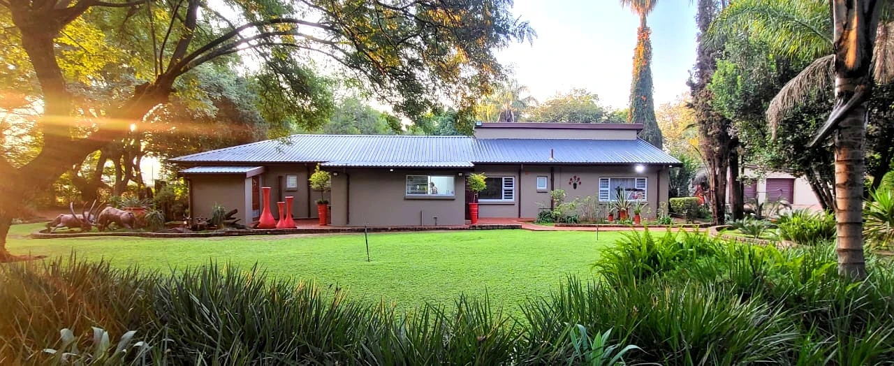 Single storey home exterior with garden landscaping