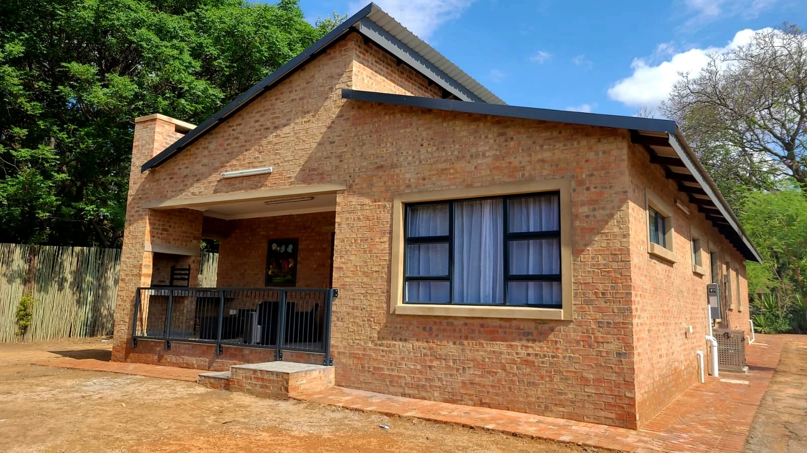 Small brick house front view with completed exterior