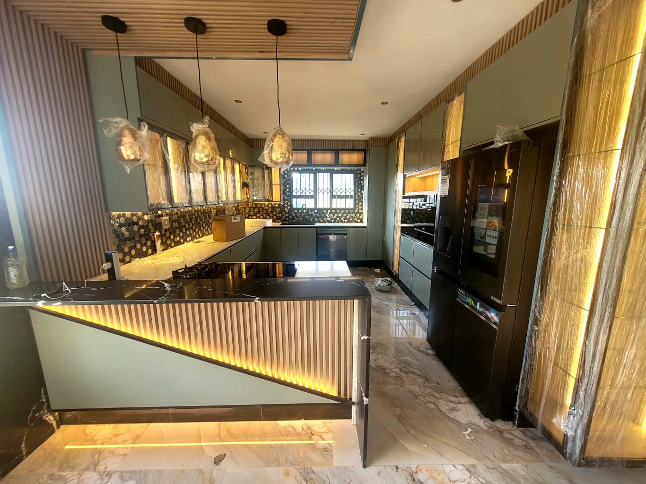 Modern kitchen interior with luxury finishes, LED lighting, marble countertops and built-in appliances in Pretoria